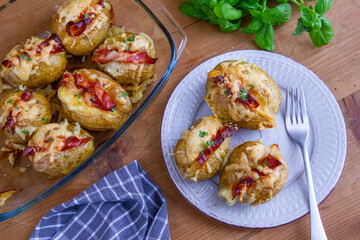 Baked potatoes with bacon and mozzarella