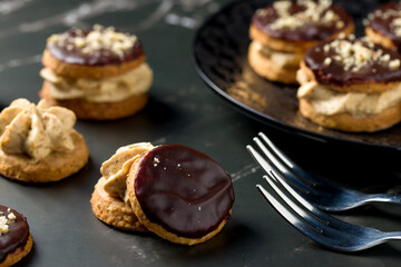 Round nut cookies with coffee and nut cream