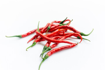 Indonesian best quality red hot chilies. A bunch of fresh curly red chilies isolated on white...