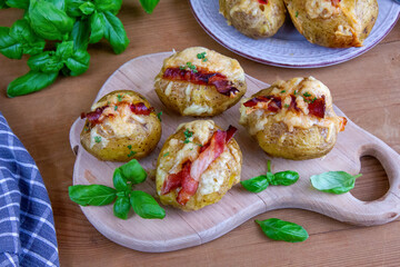 Baked potatoes with bacon and mozzarella
