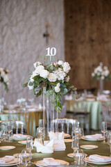 Luxury wedding table setting with flower centerpieces and candles