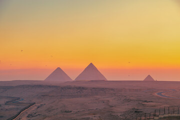 The Great Pyramids of Egypt at dawn.