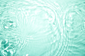 The water surface is clear green with waves.