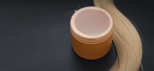 Blond long hair with cream oil jar of ripe wheat. Healthy hair. Hairdresser service, hair strength, haircut, hairstyle. Concept hairdresser spa salon.