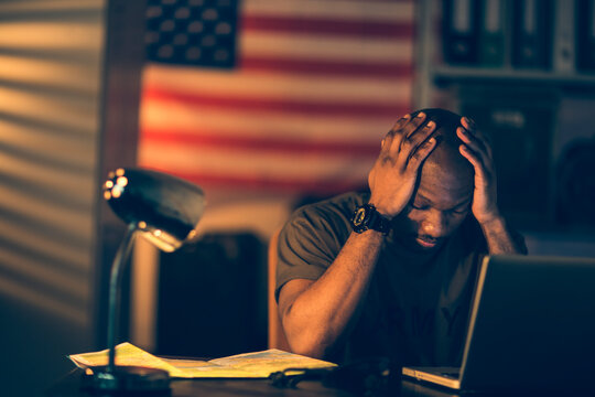 American soldier being tired and missing home while being deployed in an army base