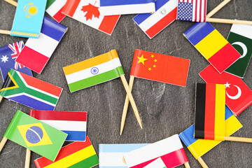 Fototapeta na wymiar The concept is diplomacy. In the middle among the various flags are two flags - China, India