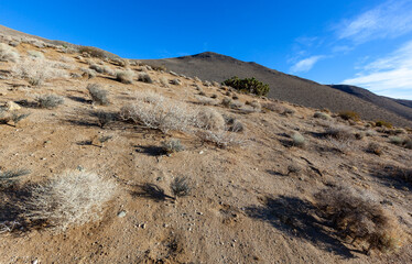 Cracked earth, dry clay, desert in the valley of mountains