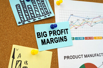 Business charts and stickers with the inscription hang on the board - Big Profit Margins - obrazy, fototapety, plakaty