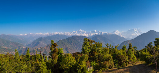 Beautiful panoramic landscape of Himalayan snow mountains from Chandrashila peak in Chopta,...