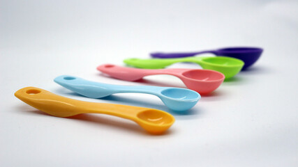 Measuring spoons in various colors