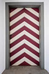 Naklejka premium Red and White Striped Door