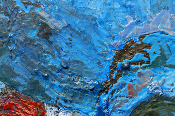 Abstract background closeup of a painting with brushstrokes. Rough art paint smear. Large multicolor spots of brush strokes and palette knife on the canvas