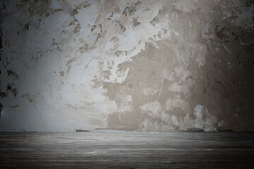 Empty room, wall and floor for product display mockup. Wall with plaster texture, rough strokes of palette knife paint on the surface. Abstract background for design.