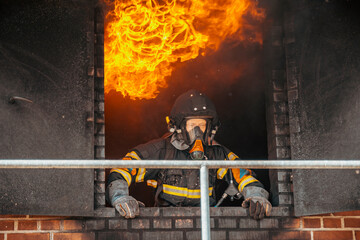 Firefighter with fire in building