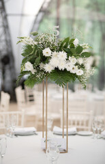 Luxury wedding table setting with flower centerpieces and candles