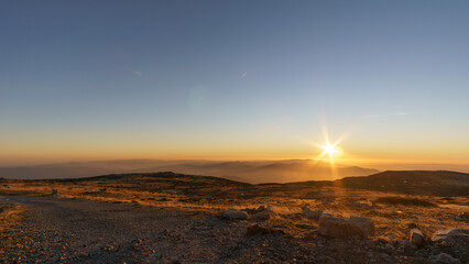 Beautiful golden sunset seen from Torre mountain peak of Serra da Estrela, Portugal