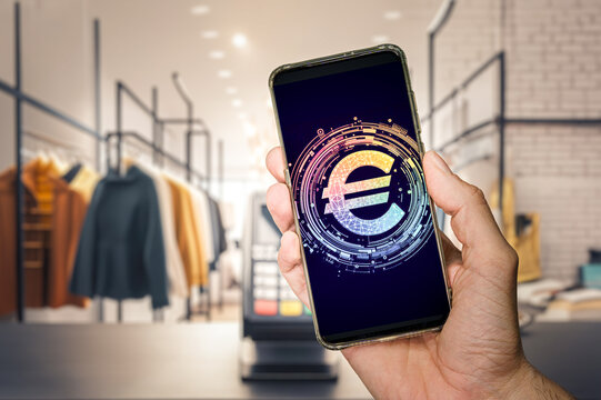 hand holding a phone displaying the digital Euro, making a seamless payment in a store