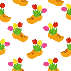 Seamless background with Dutch wooden shoe. Traditional Dutch klomp shoes and tulips.