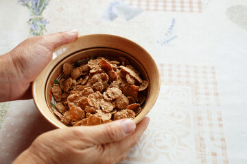 Whole grain flakes in the clay plate