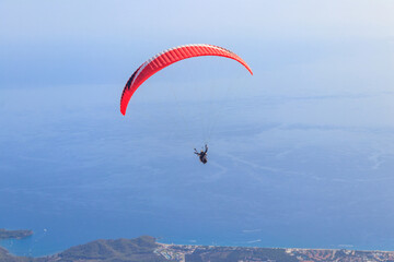 Paragliders flying from a top of Tahtali mountain near Kemer, Antalya Province in Turkey. Concept...