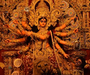 Idol of Goddess Devi Durga at a decorated puja pandal in Kolkata, West Bengal, India. Durga Puja is a popular and major religious festival of Hinduism that is celebrated throughout the world