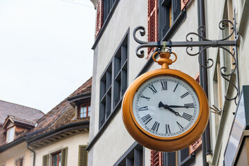 Fototapeta na wymiar Close-up of big clock on the building in Switzerland