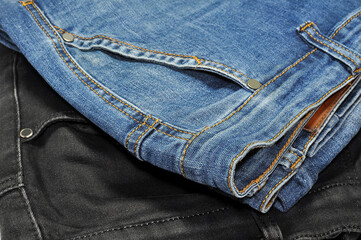 black jeans pants and blue jeans pants close-up