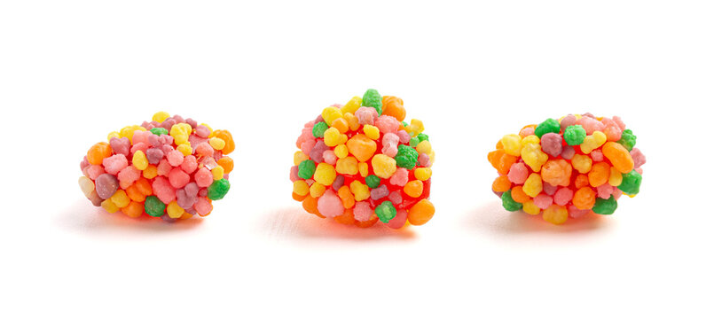 Sweet and Tangy Candy with Small Candies on the Outside of a Chewy Center Isolated on a White Background