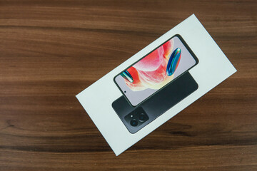 Photo of cell phone case on a wooden table and white background.