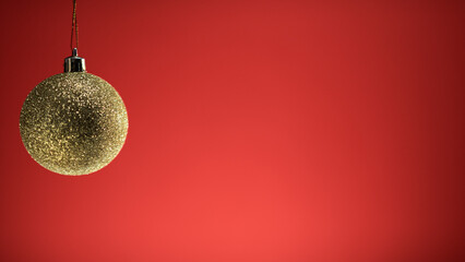 Golden Christmas Ball On Red Background copy space