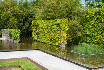 A pond in a modern landscape park. Minimalist geometrical landscape