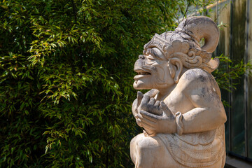 Balinese stone sculpture, traditional balinese statue. Asia and Indonesia culture - obrazy, fototapety, plakaty