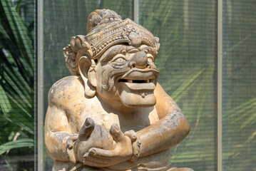 Fototapeta na wymiar Balinese stone sculpture, traditional balinese statue. Asia and Indonesia culture