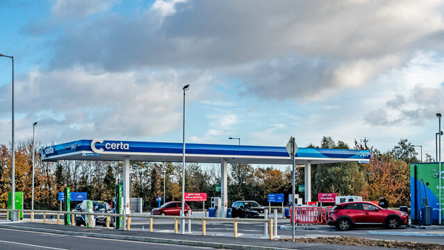 View of a Certa fuel station View of a Certa fuel station in Liffey valley, Dublin, Ireland.with vehicles and a clear sign, against a backdrop of clouds.
