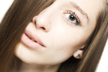 close up studio face portrait of a beautiful brunette girl with happy positive expression looking at camera...