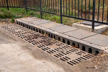 Steel drain cover with dirt, Large sewer grate. Outdoor