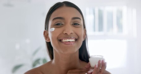 Woman, face cream and smile in bathroom with portrait, skincare or moisturizer for hydrated skin. Beauty model, indian and retinol with collagen booster, self-care and hyaluronic acid serum for pores