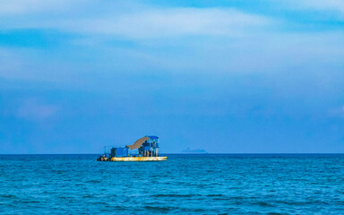 Boats yachts ship catamaran jetty beach Playa del Carmen Mexico.