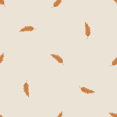 Simple seamless pattern with golden leaves on beige background. Hand drawn vector texture for wallpaper, prints, wrapping, textile