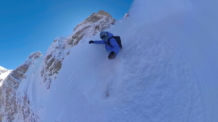 SELFIE: Fearless snowboarder descends a steep snowy mountain in Albanian Alps