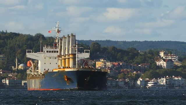 Bulk Carrier. Istanbul Bosphorus, very narrow and winding shape of the strait route makes ships travelling. It just 700m across at its narrowest point and includes 12 sharp corners. Telephoto Shot
