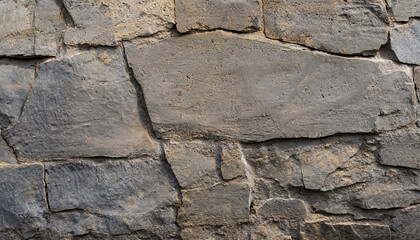 stony texture of gray cracked wall