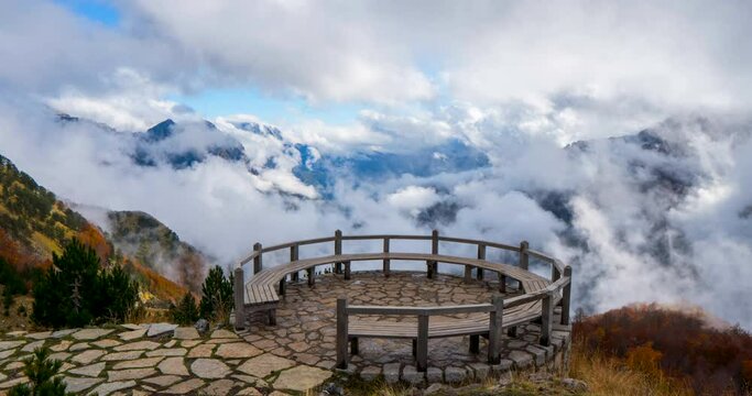 Magnificent time-lapse of a balcony to the beautiful autumnal landscape of dancing clouds. 
