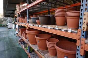 gardening store in the pots section. plastic pots for sale. pots for flowers