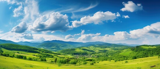 Beautiful Green hills with mountains landscape with blue sky view. AI generated