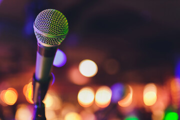 Close up of microphone in concert hall or conference room.