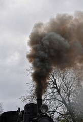 black smoke from the chimney of an old locomotive