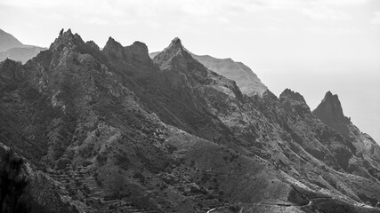 Fototapeta na wymiar The Anaga massif (Macizo de Anaga). Natural landscape of the north of Tenerife. Canary Islands. Spain. View from the observation deck - Mirador Bailadero. Black and white.