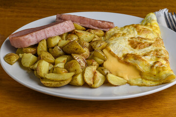 cheese omelet  with spam and a side of home fries