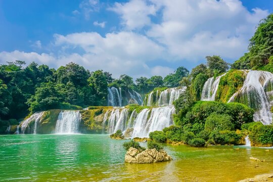 the majestic kuang krun waterfall in thailand is a must to see when travelling